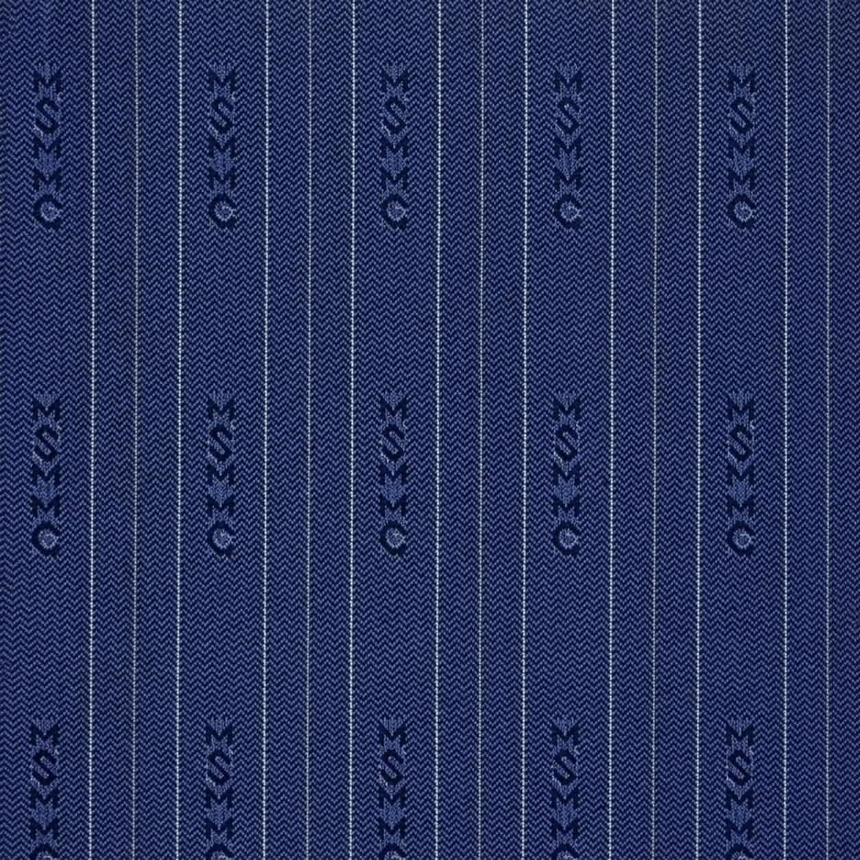 Macro crop of navy herringbone textile and pinstripes